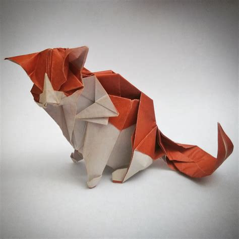 Cat by Akira Yoshizawa. Diagrams in Fun with Origami Paper Folding - Vol. 1 by Akira Yoshizawa. Diagrams in Origami: Living Nature by Akira Yoshizawa. Folded from 2 squares of rice paper+holographic wrapping paper combo.